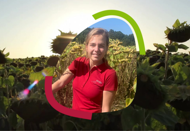 Daria in front of a sunflower field